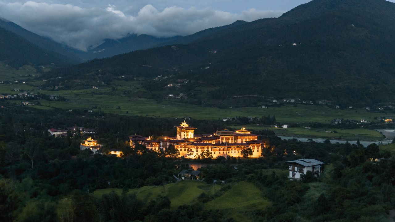 Drone shot of Bhutan with stunning mountain landscapes, lush valleys, and scenic terrain.